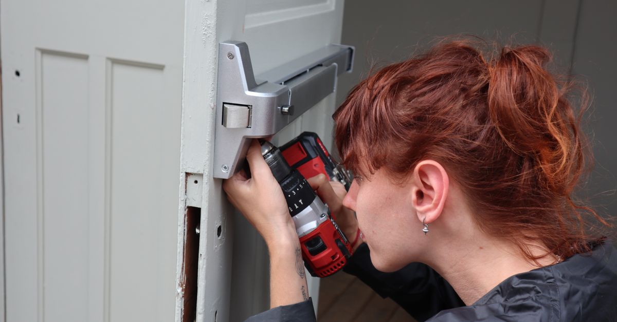Door installation with power drill for a home improvement project